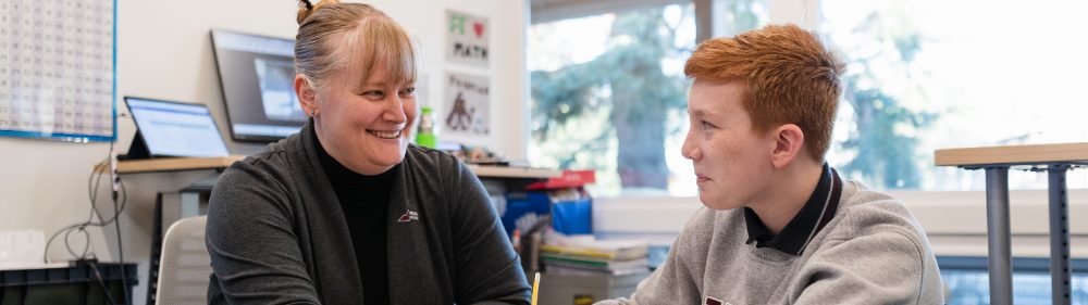 Best K-12 Private School in Calgary | Primary School Near Me | Student and Teacher Smiling Together