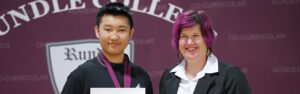 A Rundle Studio student and teacher pose for a photo at the year-end awards ceremony